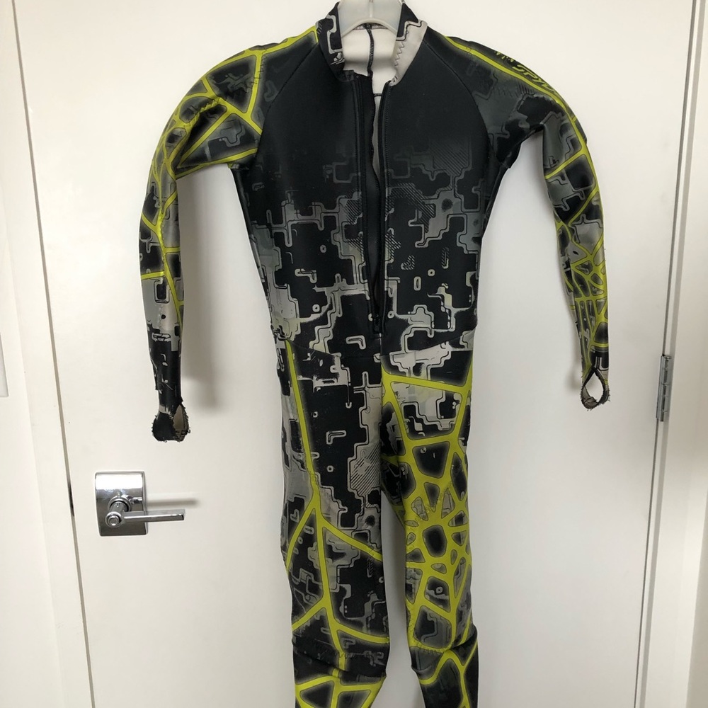 Green and yellow boys ski suit